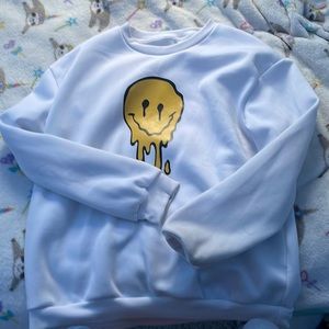 Brand: SHEIN Color: White with yellow drippy smiley face Size: Women’s Large